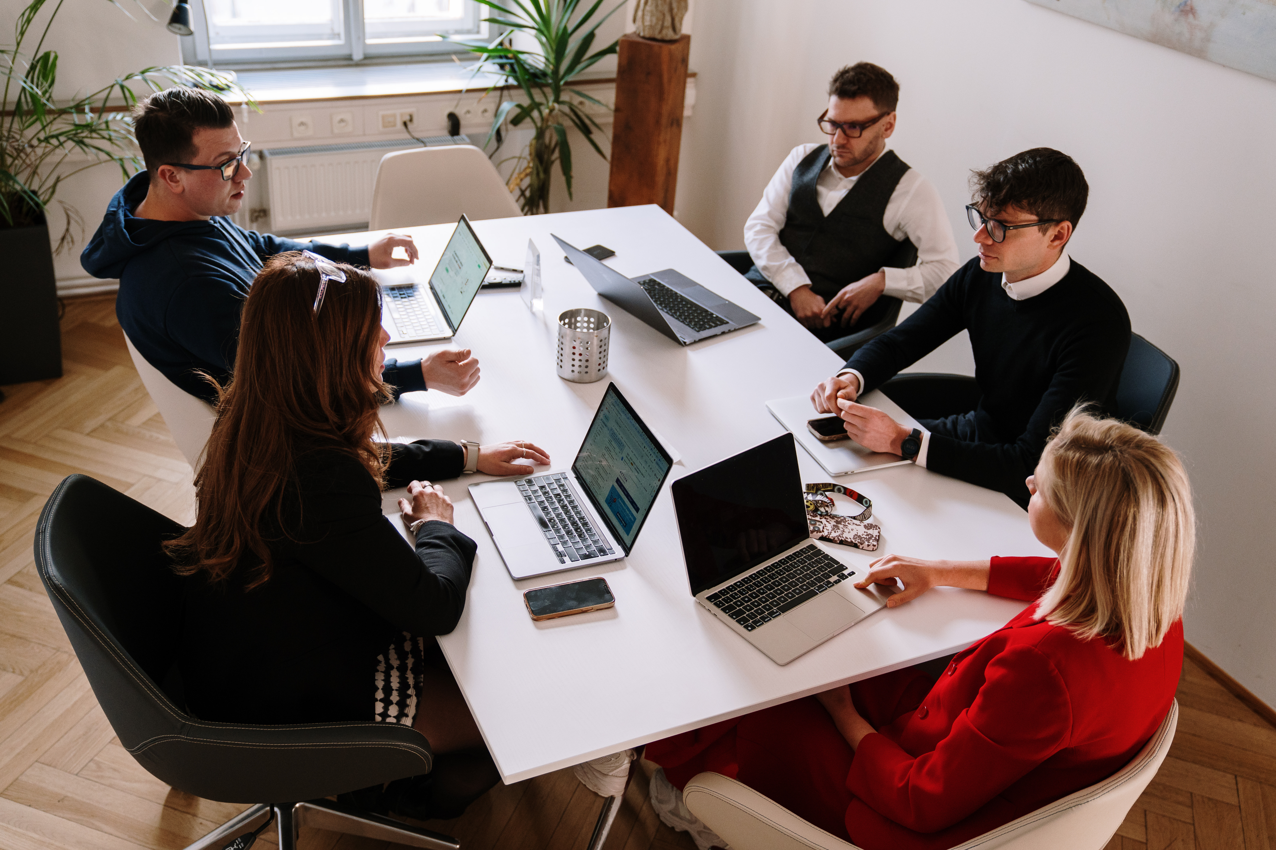 Person sitting by window working on tablet